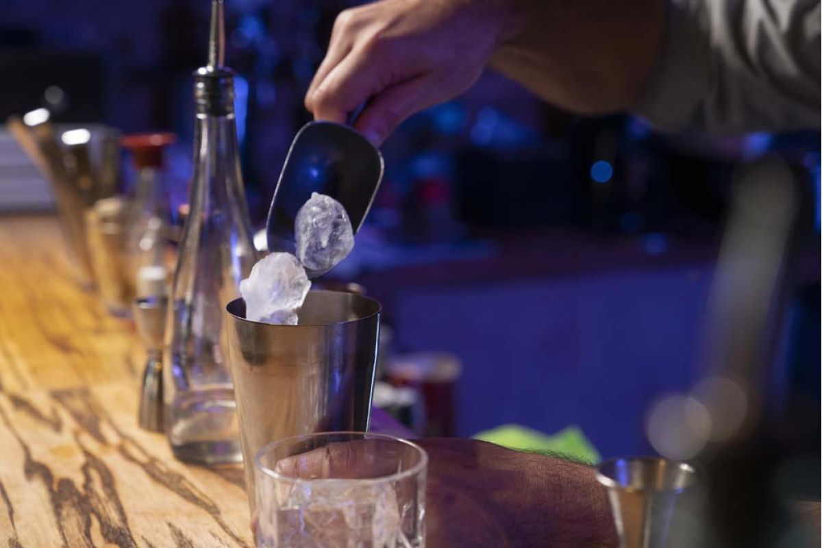 a bartender preparing a drink
